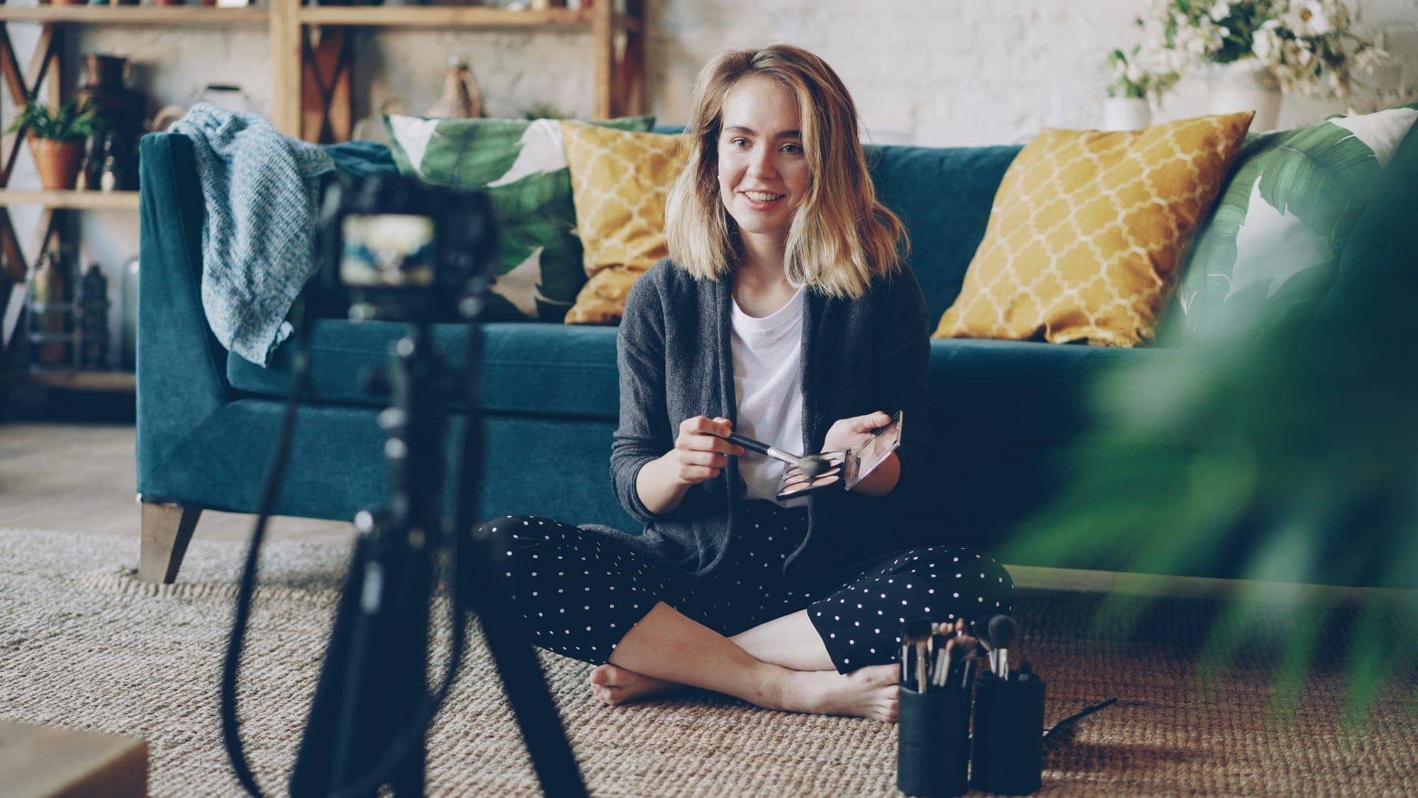 A creator planning brand collaborations on a laptop and phone